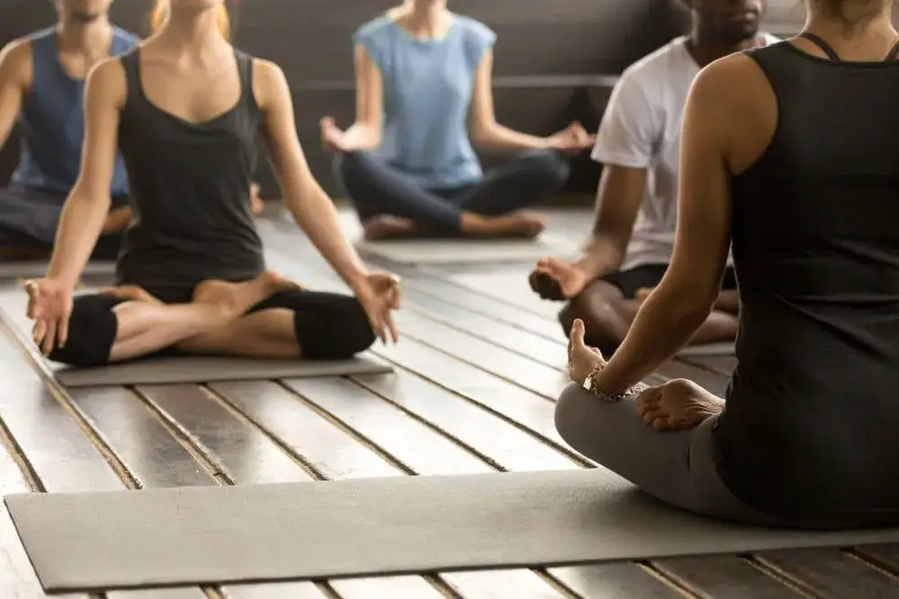 A person holding a steady pose in a Mindful Hatha class.