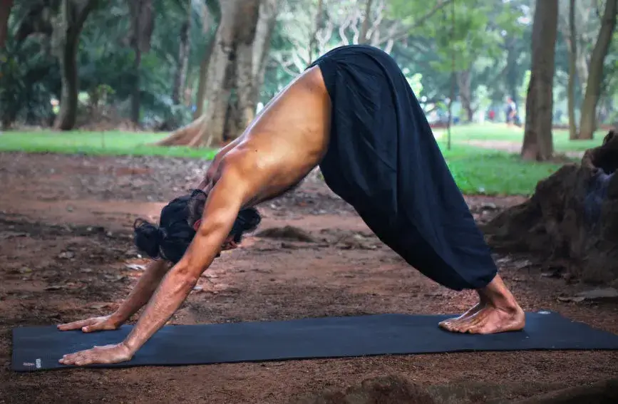 Alex Chen in a powerful yoga pose